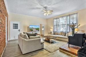 a living room with a couch and a ceiling fan at A Shore Thing in North Myrtle Beach! 4 Bedroom Home! in Myrtle Beach