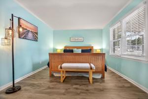 a bedroom with a bed and a lamp in it at A Shore Thing in North Myrtle Beach! 4 Bedroom Home! in Myrtle Beach