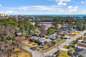 an aerial view of a town with buildings and trees at A Shore Thing in North Myrtle Beach! 4 Bedroom Home! in Myrtle Beach