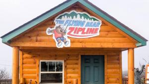 a log cabin with a sign on the roof at 1 BR Westgate Resort Sleeps 4 in Gatlinburg +1 photo