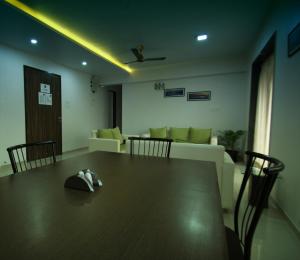 a dining room with a table with a hat on it at Aashiyana Inn in Nashik