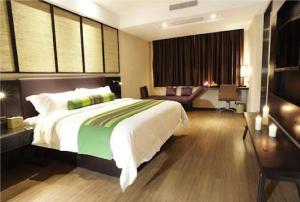 Säng eller sängar i ett rum på Season Boutique Hotel Longcheng Branch