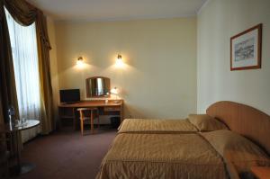 Posteľ alebo postele v izbe v ubytovaní Matejko Hotel