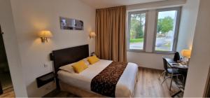 Postel nebo postele na pokoji v ubytování Hotel le Bellevue