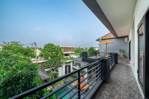 a balcony with a view of a building at Sunbeji - Relax and Unwind - Seminyak Luxury Stay with Private Pool in Seminyak
