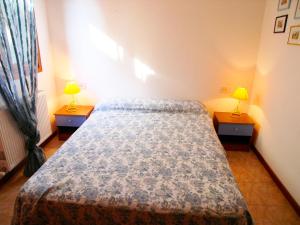 Un pat sau paturi într-o cameră la Casa Sonneninsel