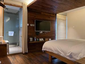 Voodi või voodid majutusasutuse Huangshan Shanshui Boutique Hotel Liyang Scenic Area toas