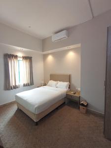 Ein Bett oder Betten in einem Zimmer der Unterkunft Hyba Heritage Guest House