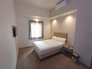 Ein Bett oder Betten in einem Zimmer der Unterkunft Hyba Heritage Guest House