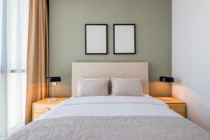 Voodi või voodid majutusasutuse Silkhaus elegant 1BDR in Downtown Views with pool & gym access toas