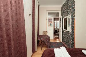Postel nebo postele na pokoji v ubytování Tuta House Sighnaghi