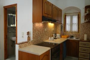 Kuchyň nebo kuchyňský kout v ubytování Antoni's Symi Home
