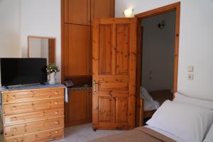 Postel nebo postele na pokoji v ubytování Antoni's Symi Home