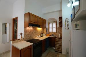 Kuchyň nebo kuchyňský kout v ubytování Antoni's Symi Home