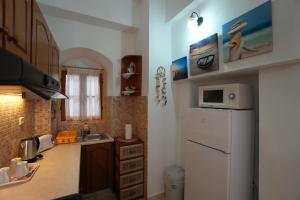 Kuchyň nebo kuchyňský kout v ubytování Antoni's Symi Home