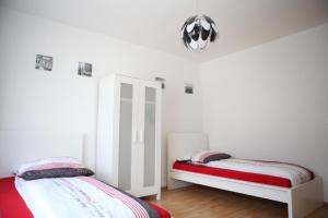 Katil atau katil-katil dalam bilik di White House Bochum II +5 gambar