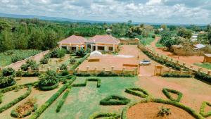 an aerial view of a house with a garden at MARK-A VACATION Home in Kasulu