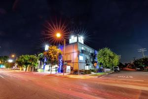 a building on a street at night with a street light at Rodeway Inn & Suites Pasadena in Pasadena