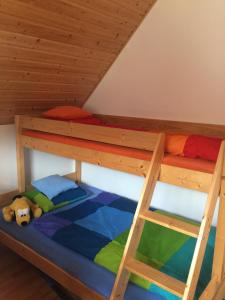 Posteľ alebo postele v izbe v ubytovaní Domek Wakacyjny Na Złotych Wydmach