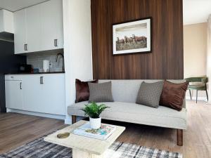 a living room with a couch and a table at The Sylmar House in Sylmar