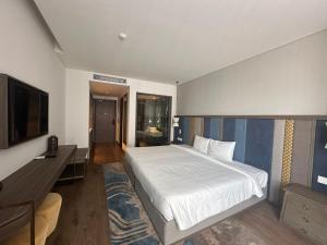 Ένα ή περισσότερα κρεβάτια σε δωμάτιο στο Mandala Coastal Retreat Mũi Né