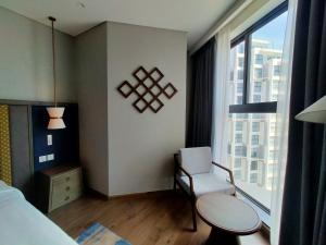 Ένα ή περισσότερα κρεβάτια σε δωμάτιο στο Mandala Coastal Retreat Mũi Né +1 φωτογραφίες