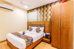 Postel nebo postele na pokoji v ubytování FabHotel Arton Suite - Nr Mumbai International Airport + 21 fotografií
