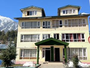 a large white building with aventh floor at New snow view resort pahalgam in Pahalgām
