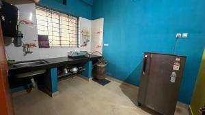 Kuchyň nebo kuchyňský kout v ubytování Hi5 Holiday Apartments - Udupi