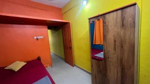 Postel nebo postele na pokoji v ubytování Hi5 Holiday Apartments - Udupi