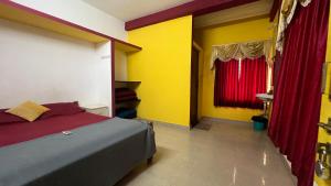 Postel nebo postele na pokoji v ubytování Hi5 Holiday Apartments - Udupi