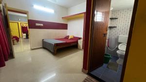 Postel nebo postele na pokoji v ubytování Hi5 Holiday Apartments - Udupi