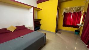 Postel nebo postele na pokoji v ubytování Hi5 Holiday Apartments - Udupi