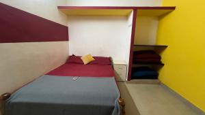 Postel nebo postele na pokoji v ubytování Hi5 Holiday Apartments - Udupi