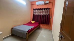Postel nebo postele na pokoji v ubytování Hi5 Holiday Apartments - Udupi