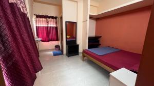 Postel nebo postele na pokoji v ubytování Hi5 Holiday Apartments - Udupi
