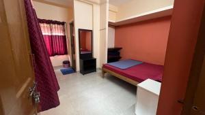 Postel nebo postele na pokoji v ubytování Hi5 Holiday Apartments - Udupi