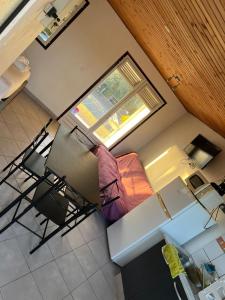 an overhead view of a living room with a table and chairs at Bungalow Sainte-Anne in Sainte-Anne