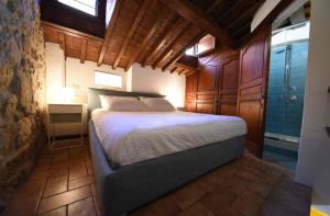 a bedroom with a large bed in a room at Nuraghe di mare in La Maddalena