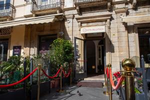 a building with a red rope in front of it at Hotel della Piazza in Pizzo