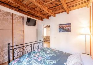 Ένα ή περισσότερα κρεβάτια σε δωμάτιο στο AL VICOLETTO