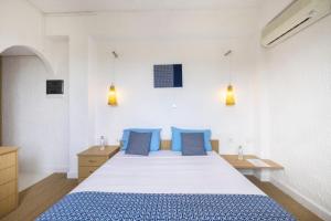Postel nebo postele na pokoji v ubytování Lassion Hotel