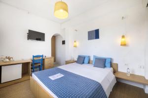 Postel nebo postele na pokoji v ubytování Lassion Hotel