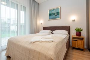 Ένα ή περισσότερα κρεβάτια σε δωμάτιο στο Vila Barbora 2