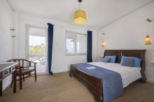 Postel nebo postele na pokoji v ubytování Lassion Hotel