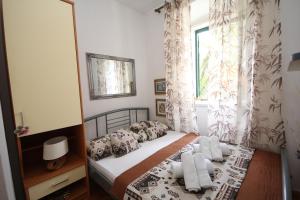 Posteľ alebo postele v izbe v ubytovaní Apartment Adriatica City