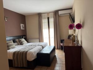 Postel nebo postele na pokoji v ubytování Hotel Guara Inlukā