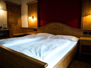 Postel nebo postele na pokoji v ubytování Garnì Costa Verde