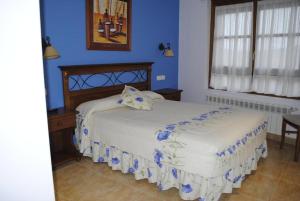 Un pat sau paturi într-o cameră la Hotel Rural La Corte de los Pinares