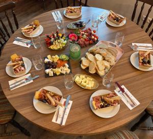 a wooden table with plates of food on it at Katharina Haus, Wiel in Wiel